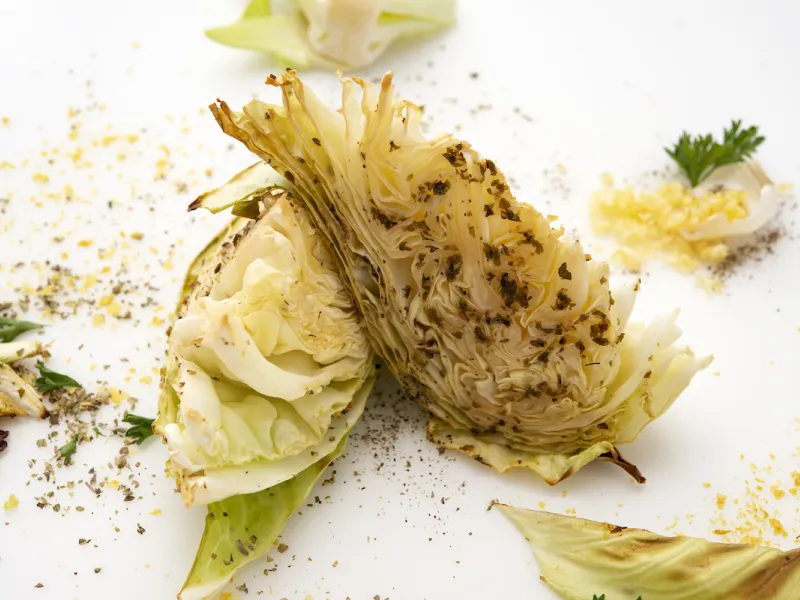 Two roasted cabbage wedges