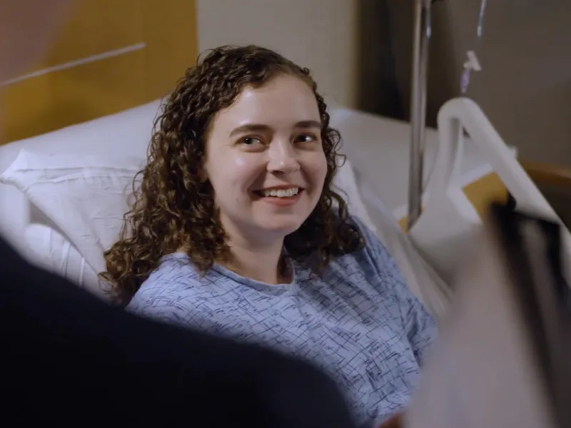An AdventHealth Translational Research Institute Patient Smiles at an Off Camera Provider