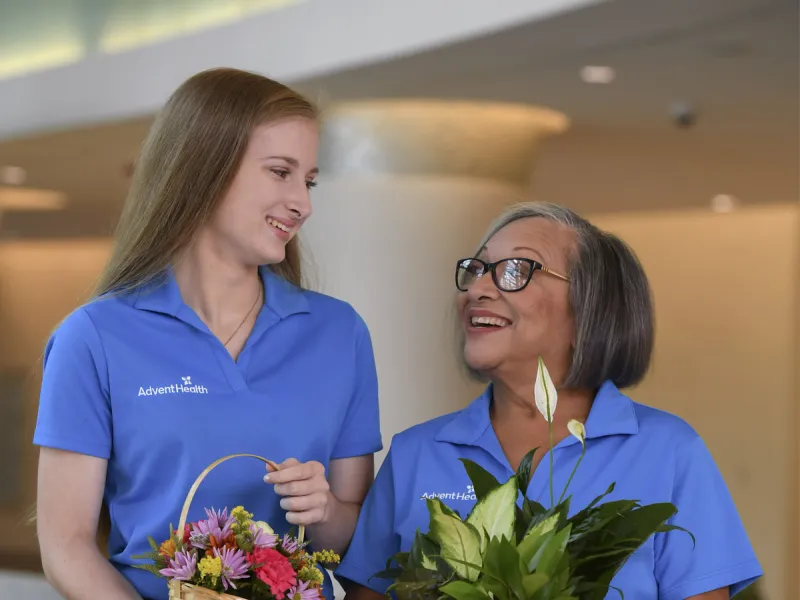 Volunteers holding gifts