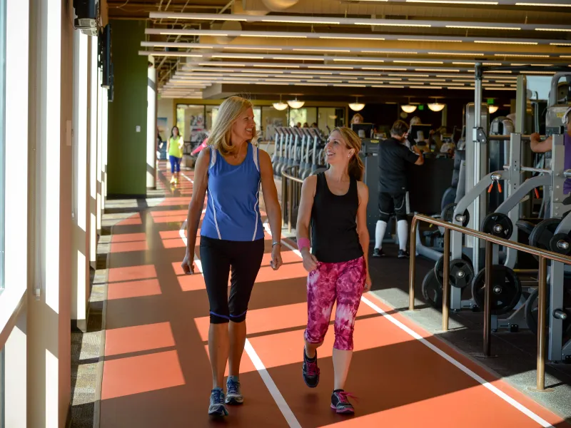 Two Ladies Enjoy Walking Together.