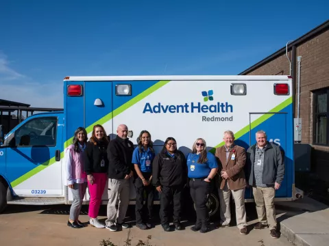 Faculty, superintendents and AdventHealth Redmond EMS gather to celebrate the new ambulance