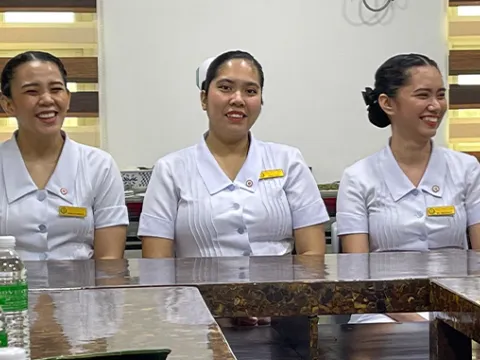 Filipino nurses sitting at a table