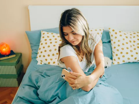 A Woman Checks Her Blood Sugar Levels After Waking Up.