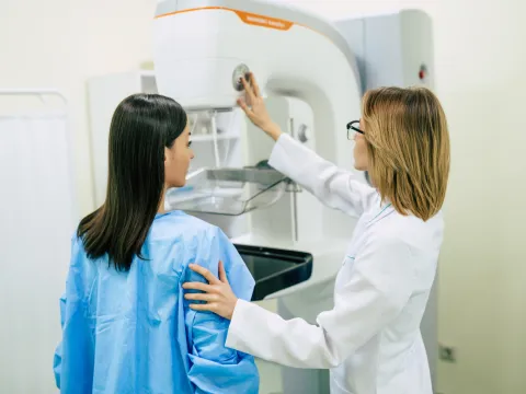 A Provider Prepares a Patient for Her Mammogram.