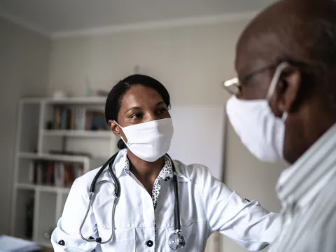 A Doctor Consoles a Patient in her Office
