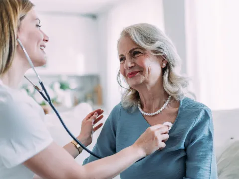 Older female patient with female physician.