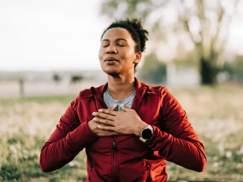 Woman taking a deep breath