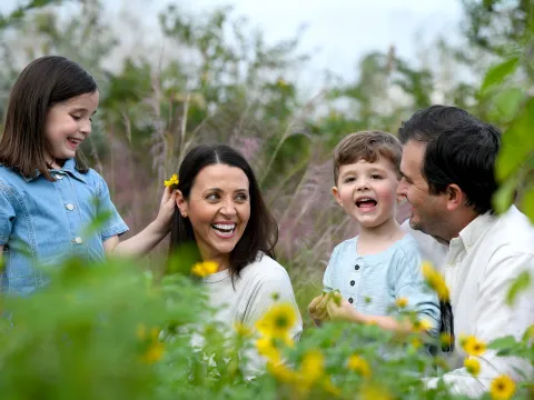 A happy family spending times outdoors.