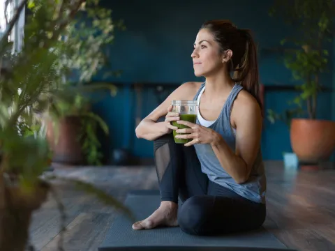 A woman stretching at home.