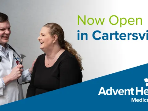 A male doctor laughs with a female patient. Text reads, "Now Open in Cartersville" and "AdventHealth Medical Group."