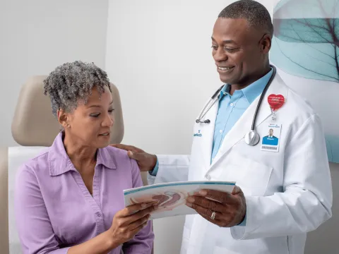 A Doctor Goes Over a Chart with a Patient