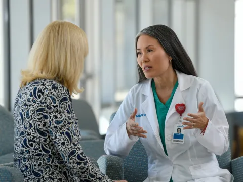 Doctor speaking with patient giving expert advice