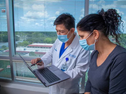 Dr. Iswanto Sucandy with a patient.