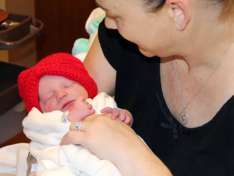Baby Lexi with red hat for News