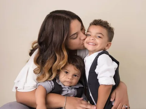 mother embracing her children