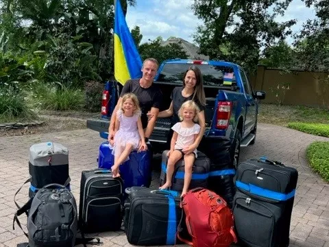 Julia and Oleg Kostyuk with their daughters Elise and Kate