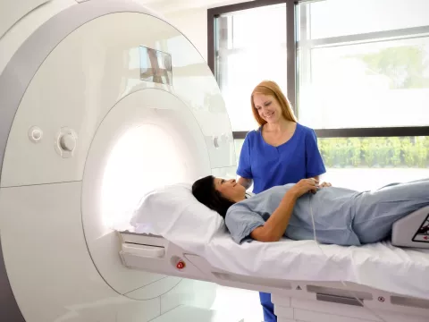 A woman prepares for an MRI.