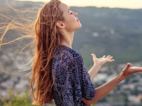 A woman takes a moment to achieve spiritual wellness.