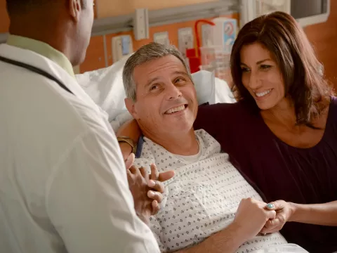 Patient and family member speaking with physician