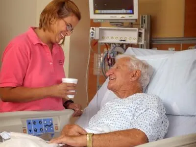 Volunteer talking with Elderly Patient