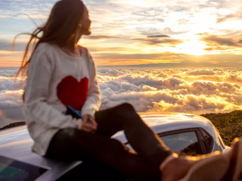 A woman celebrates a healthy heart.