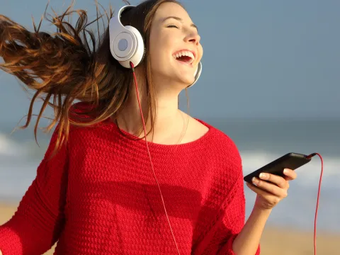Woman Dancing on the Beach