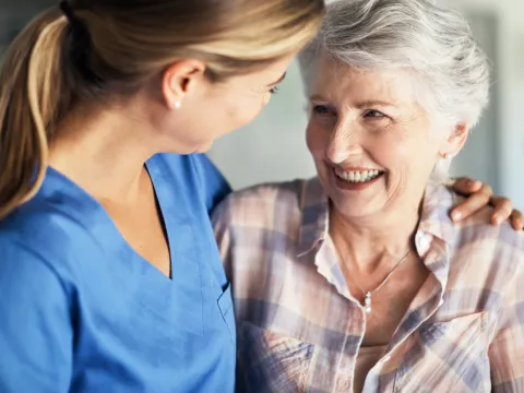 Woman comforted by medical professional