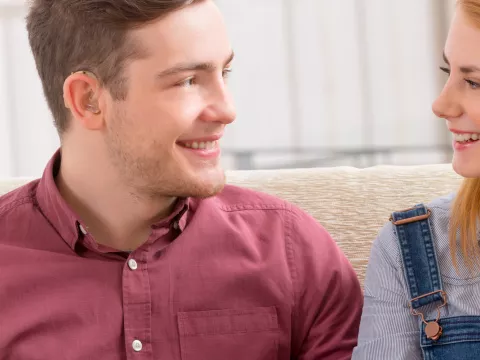 Young man with hearing aid