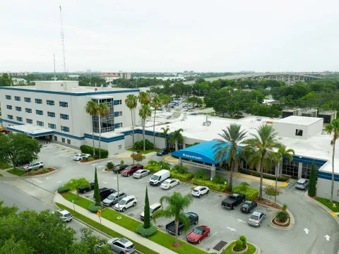 A bird's-eye view of the AdventHealth New Smyrna building and surrounding area.