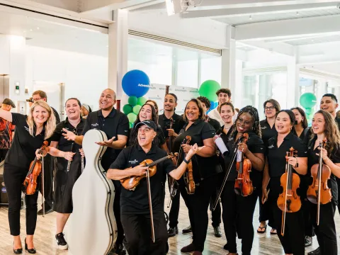 Group photo of members of the AdventHealth Orchestra.