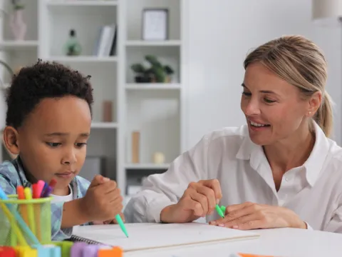 young-boy-coloring-adult-woman