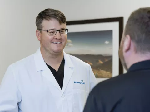 blake olson speaks with a patient