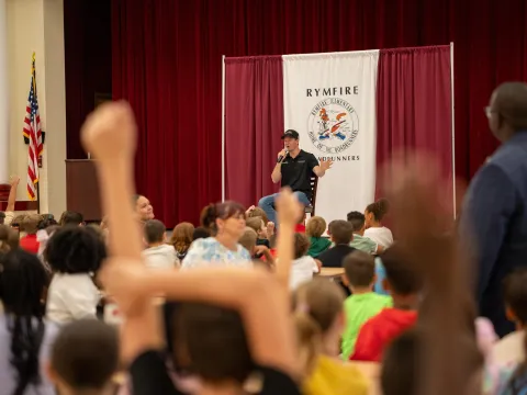 NASCAR driver shares stories and a surprise with Rymfire students