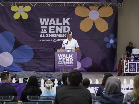 Craig Brubaker speaks before audience at Walk to End Alzheimer's