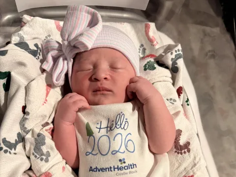 Baby Eliza arrived at 12:21 a.m. Jan. 1, 2026. She is seen in a baby outfit atop a blanket.