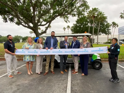 Leaders from AdventHealth Heart of Florida, AdventHealth Polk Foundation and HOAR Construction cut the ribbon for the new visitor shuttle during a special ceremony.