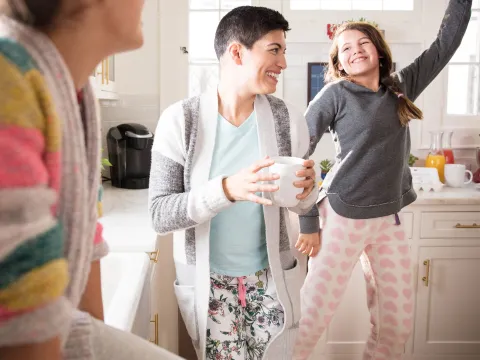Three women's generations having fun in the kitchen