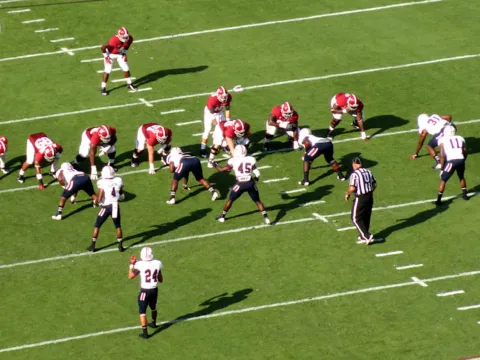 Alabama football players on the field.