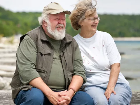 A couple enjoys a day together at a lake.