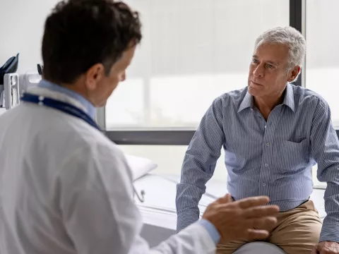 A Doctor Speaks to His Senior Patient About His Treatment Plan in an Exam Room