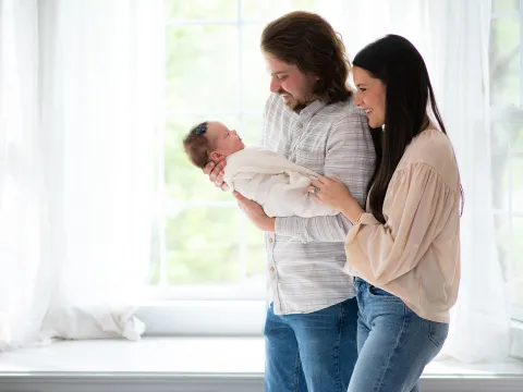 The Trapp family with their newborn daughter