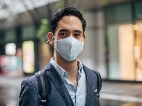 man walking with mask