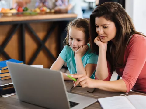 Mother and daughter at computer.