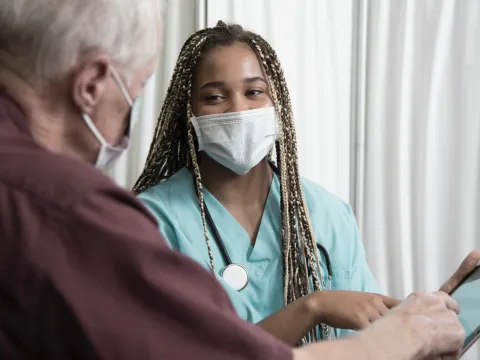 A man reviewing his test results on a tablet.
