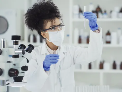 A woman conducting a lab test.
