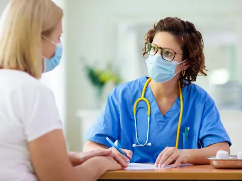 A woman visiting her health care provider. 