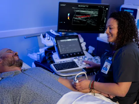 A male patient receiving an arm ultrasound.