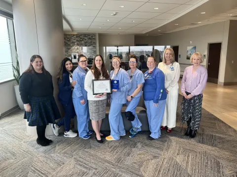 Nurses holding an award