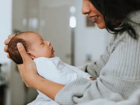 Mom holding infant