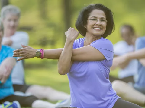 Woman stretching in a park